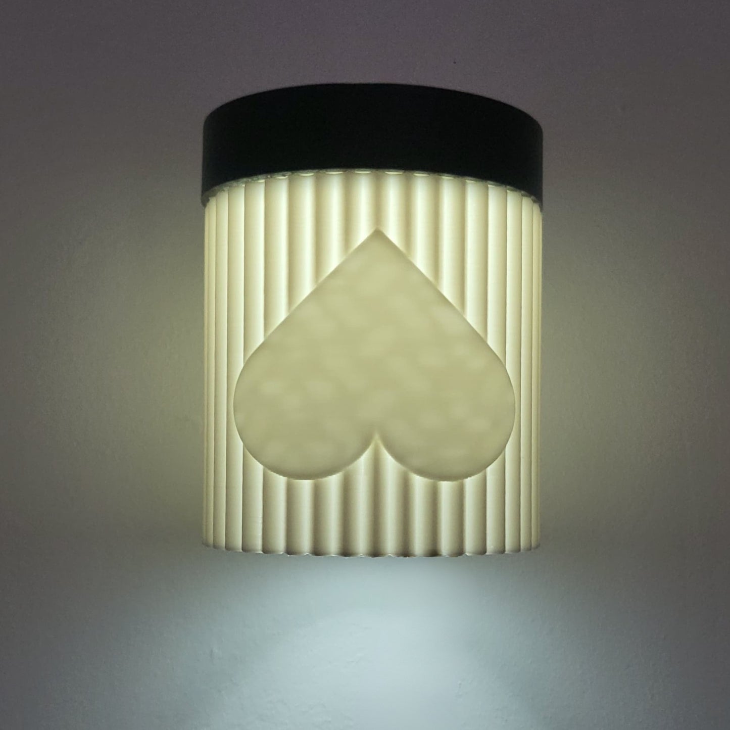 Wall-mounted light fixture with a unique design on a gray background