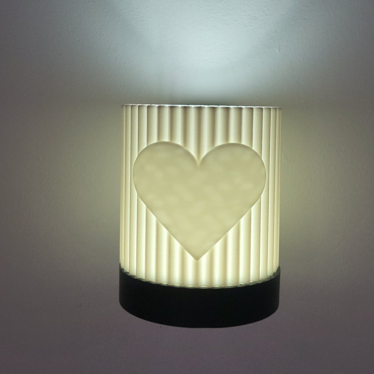 Decorative lamp with a heart design on a gray background