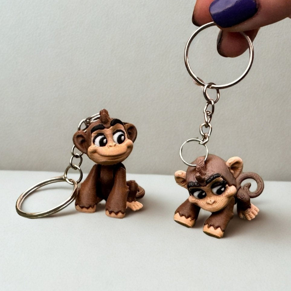 Flat lay of the monkey figure surrounded by artificial leaves, tiny pebbles, and jungle-themed props, creating a playful and adventurous jungle atmosphere.
