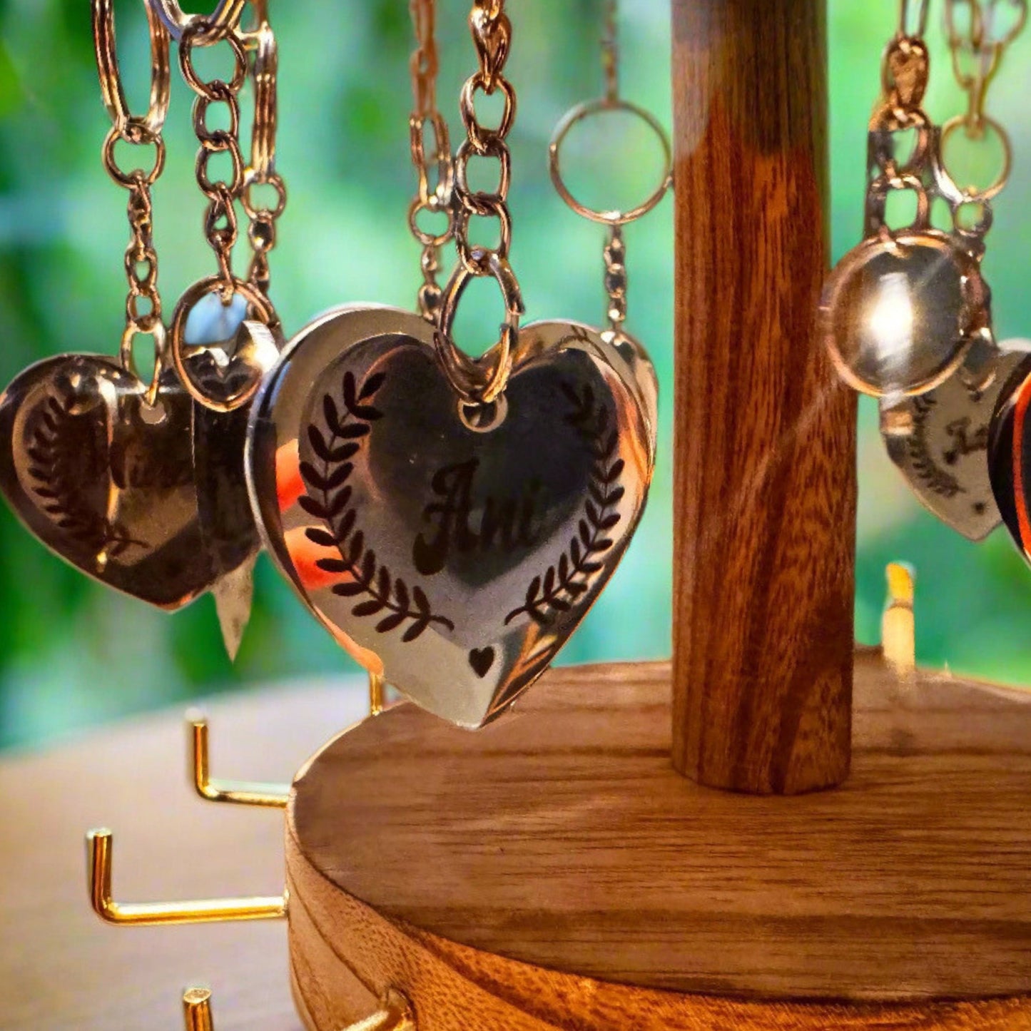 A custom stainless steel pet ID tag shaped like a heart, clipped to a leather collar, lying beside a sleepy cat – practical and beautiful, merging identity with love and care