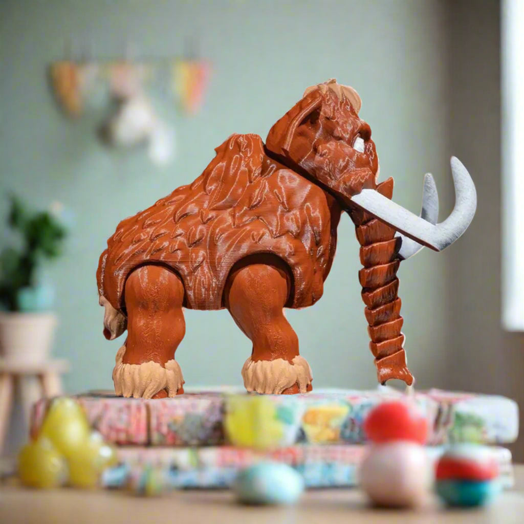 Toy figure of a mammoth with a white background