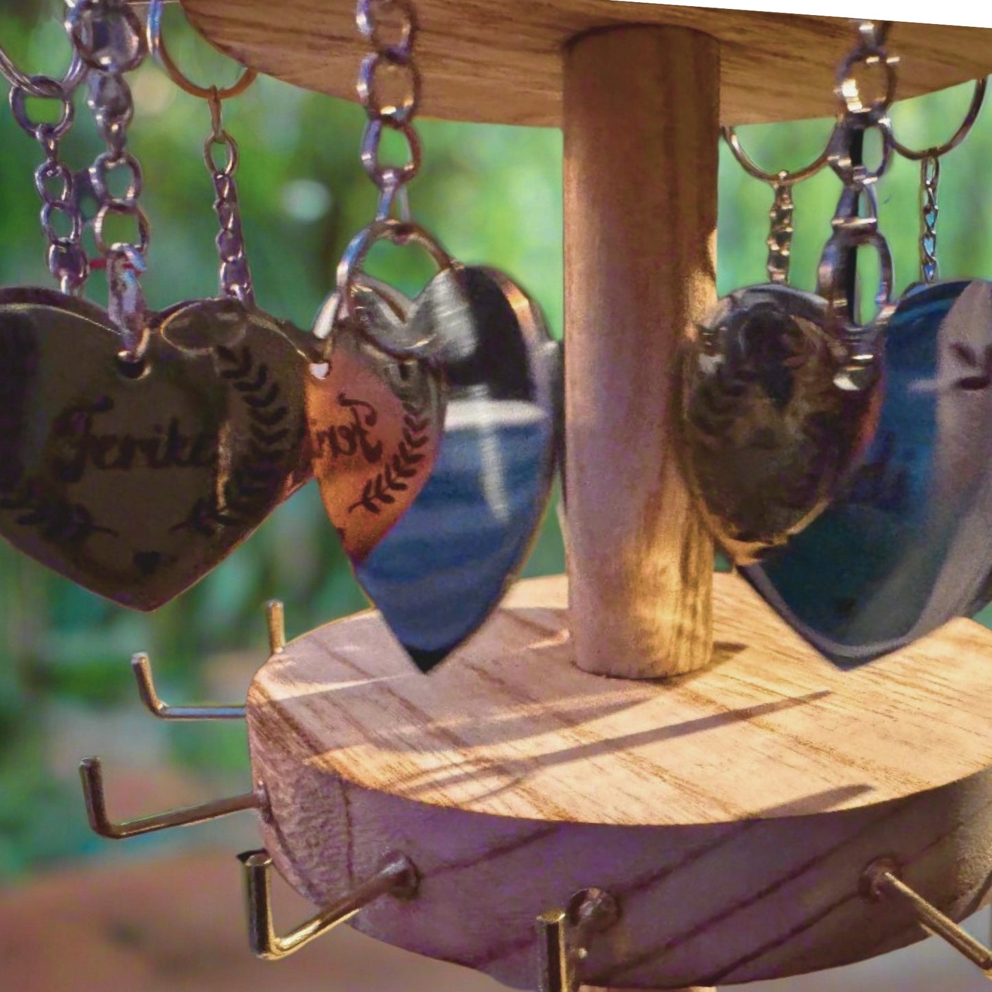 A close-up of a hand holding a heart-shaped engraved charm gently, with light falling on the message 'I carry you with me' – capturing emotion, loss, and a symbolic connection that lives on.