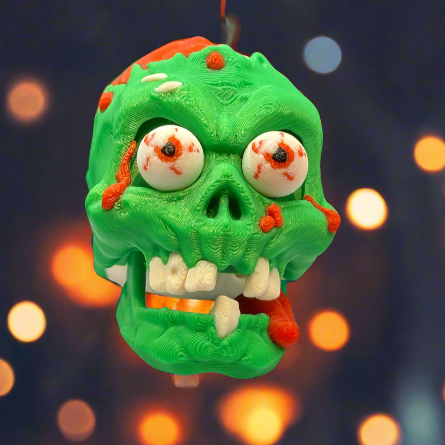 Zombie Skull Keychain – creepy skull design, ideal for keys or backpacks.