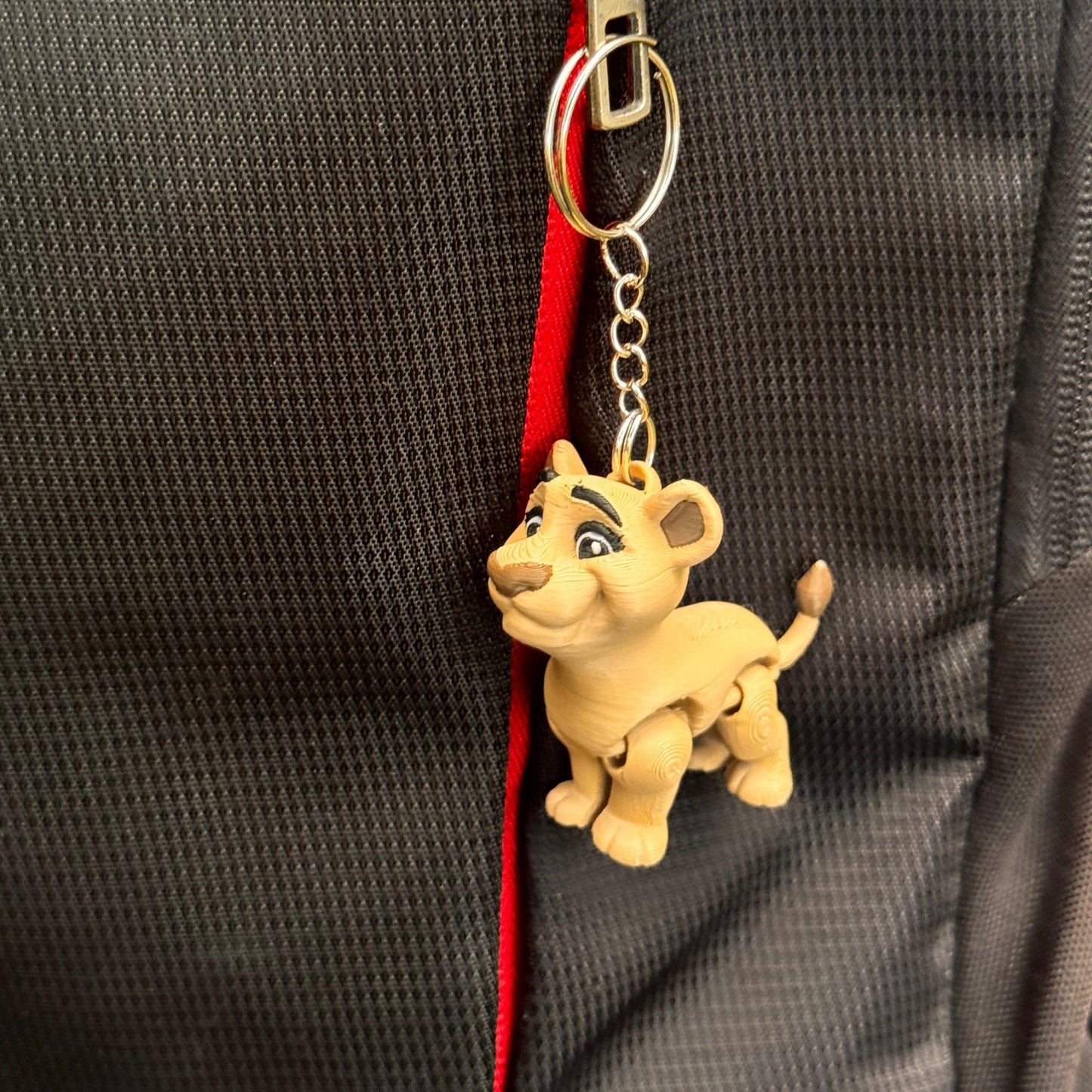 Multiple lion couple keychains in different colors are lined up in a row, offering variety for shoppers. Each one has its own slightly unique texture and finish, proving how one-of-a-kind and collectible these little companions can be.