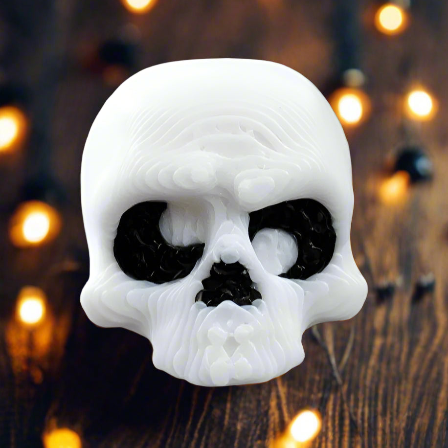 White skull-shaped object on a black background