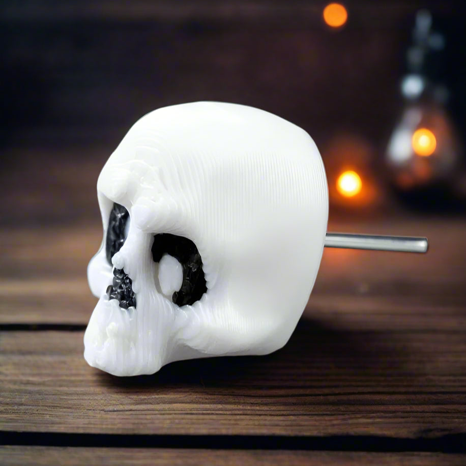 Child wearing one skeleton earring and smiling, demonstrating the playful, kid-friendly side of this lightweight Halloween-themed jewelry piece.