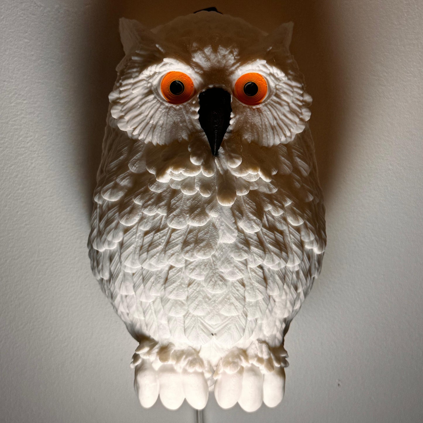 Hedwig the Owl Night Lamp mounted in a nursery, adding a whimsical and magical touch to the room decor