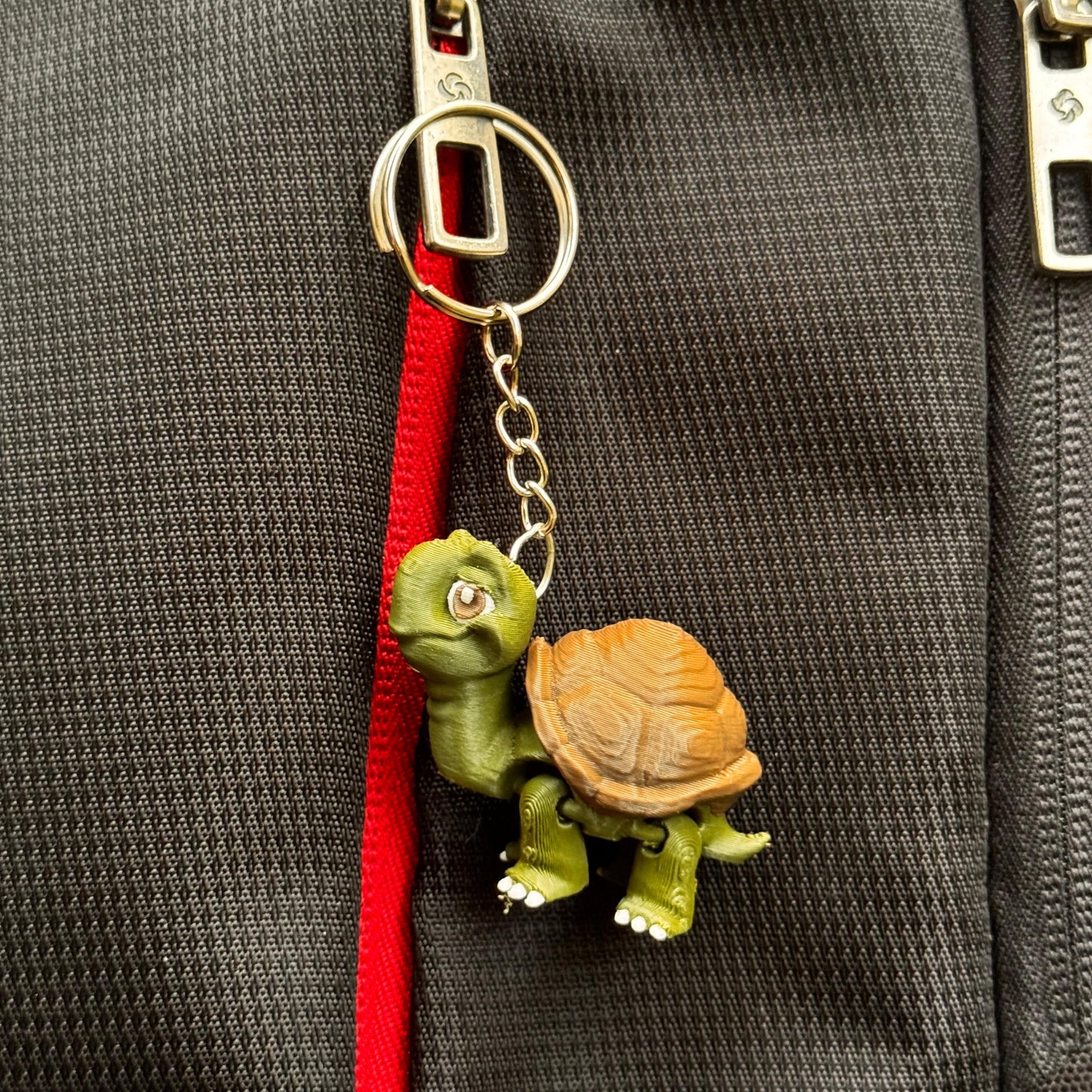 Group shot of the Riverbank Gang keychains on a neutral background, with their cheerful faces and jungle river feel.
