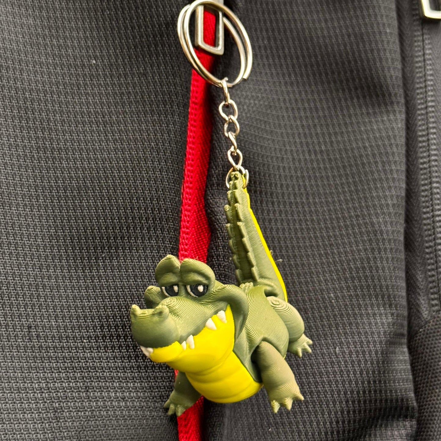 Crocodile and turtle keychains side by side, showing contrasting shapes and complementary color design, made with eco-conscious materials.