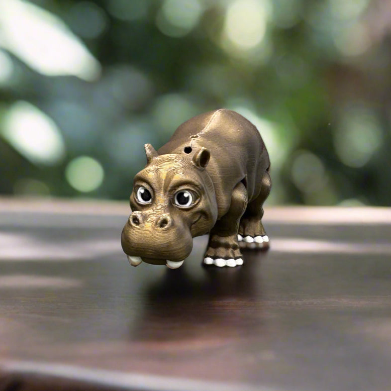 The monkey keychain is attached to the zipper of a bright backpack, swinging slightly, showing how it adds a fun, personal touch to school bags or travel gear.