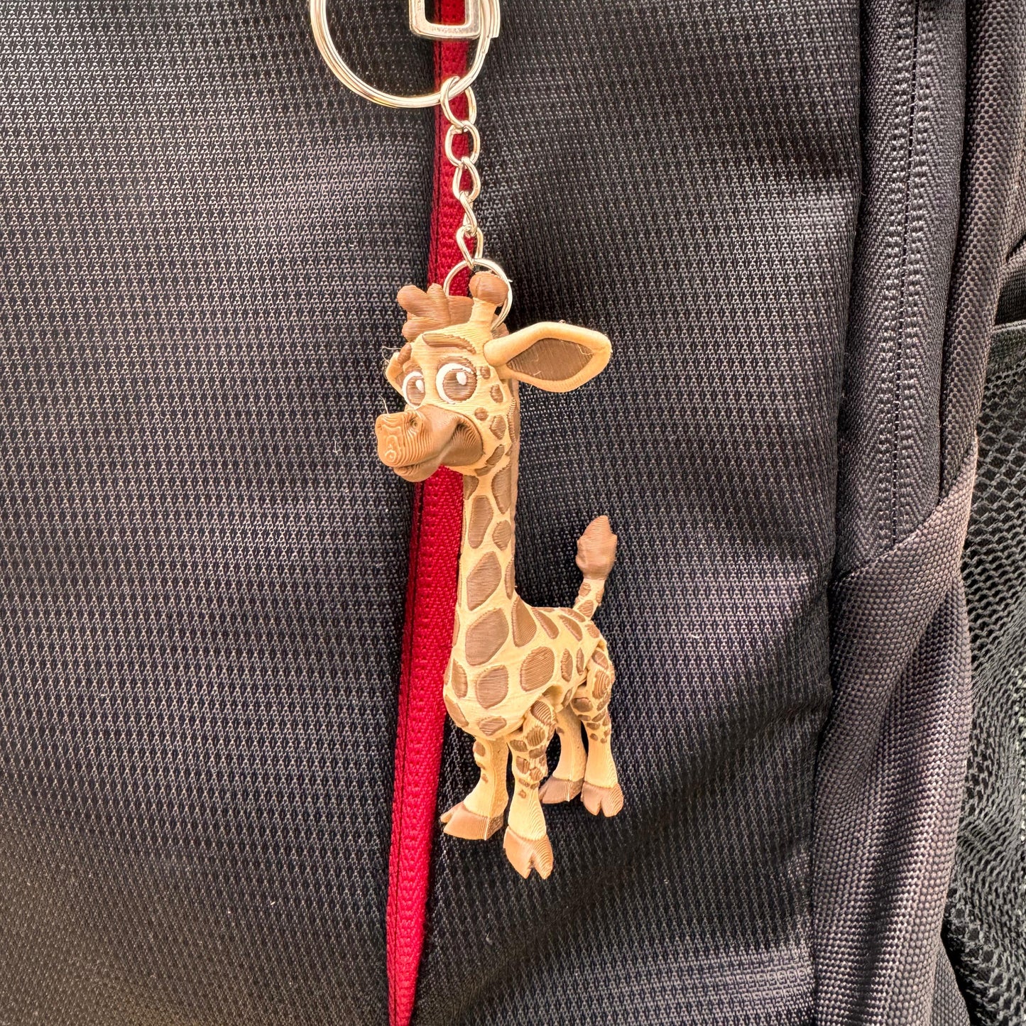 Adorable elephant keychain with oversized ears and a happy expression, made from lightweight eco-friendly PLA using 3D printing technology.