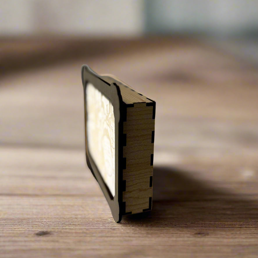 Small rectangular light on a wooden surface with a blurred background