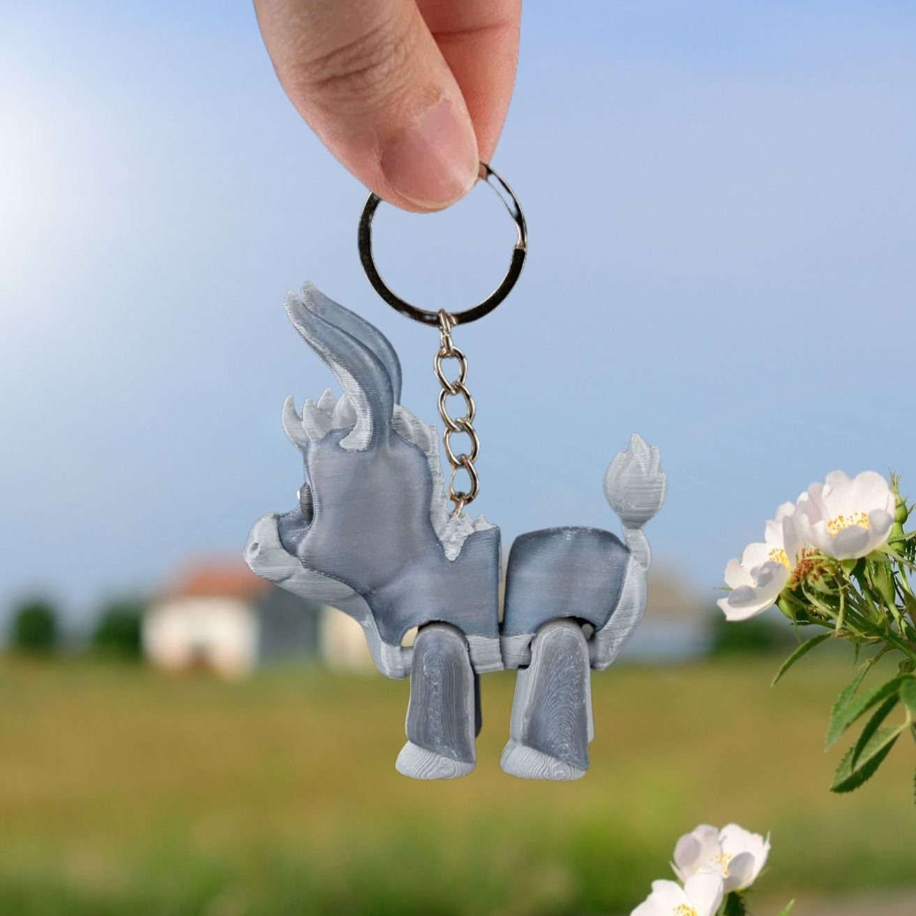 Donkey keychain clipped to a backpack zipper, adding a touch of rustic charm. The figure features long ears and expressive eyes in a sturdy, fun design.