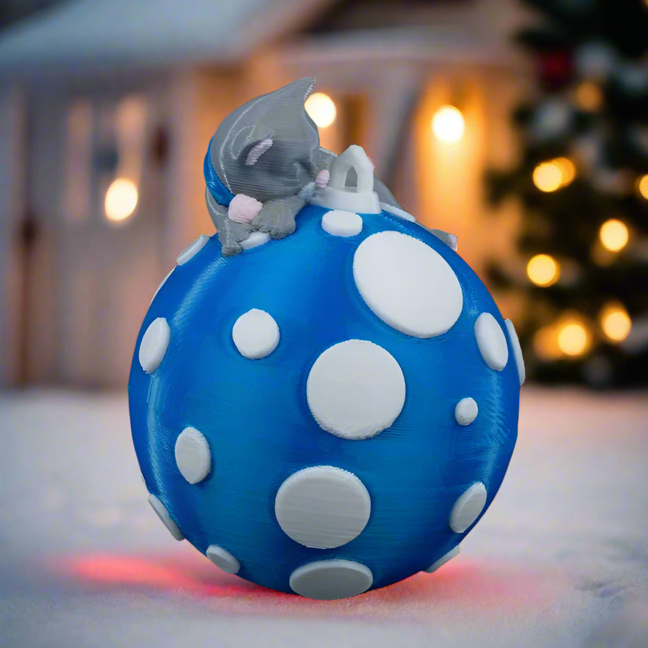 Christmas tree close-up with Sleeping Cat ornament, perfect for dog lovers