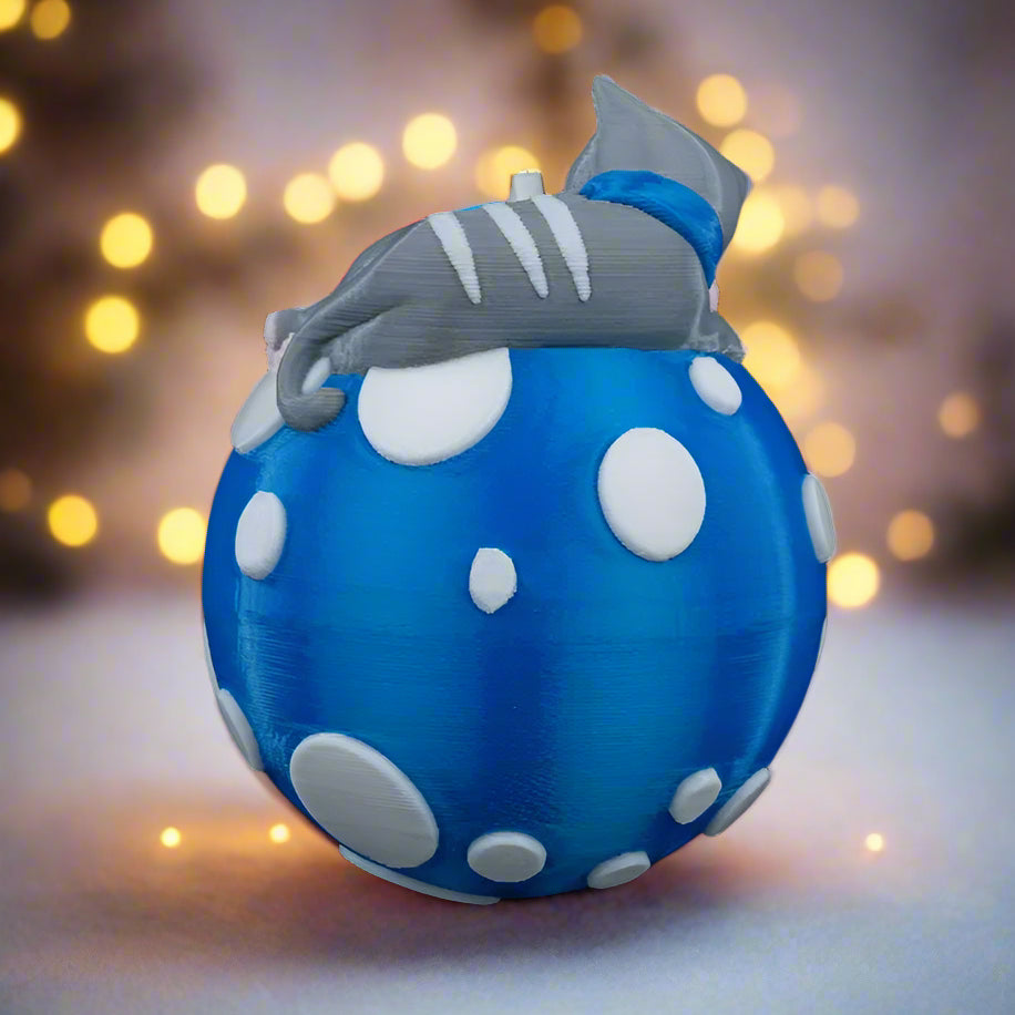 Blue inflatable mushroom with a gray cap against a blurred light background