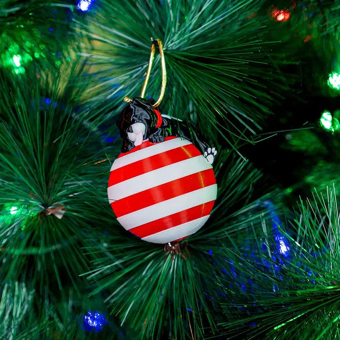 3D Printed Sleeping Dog ornament with fine details on a Christmas tree
