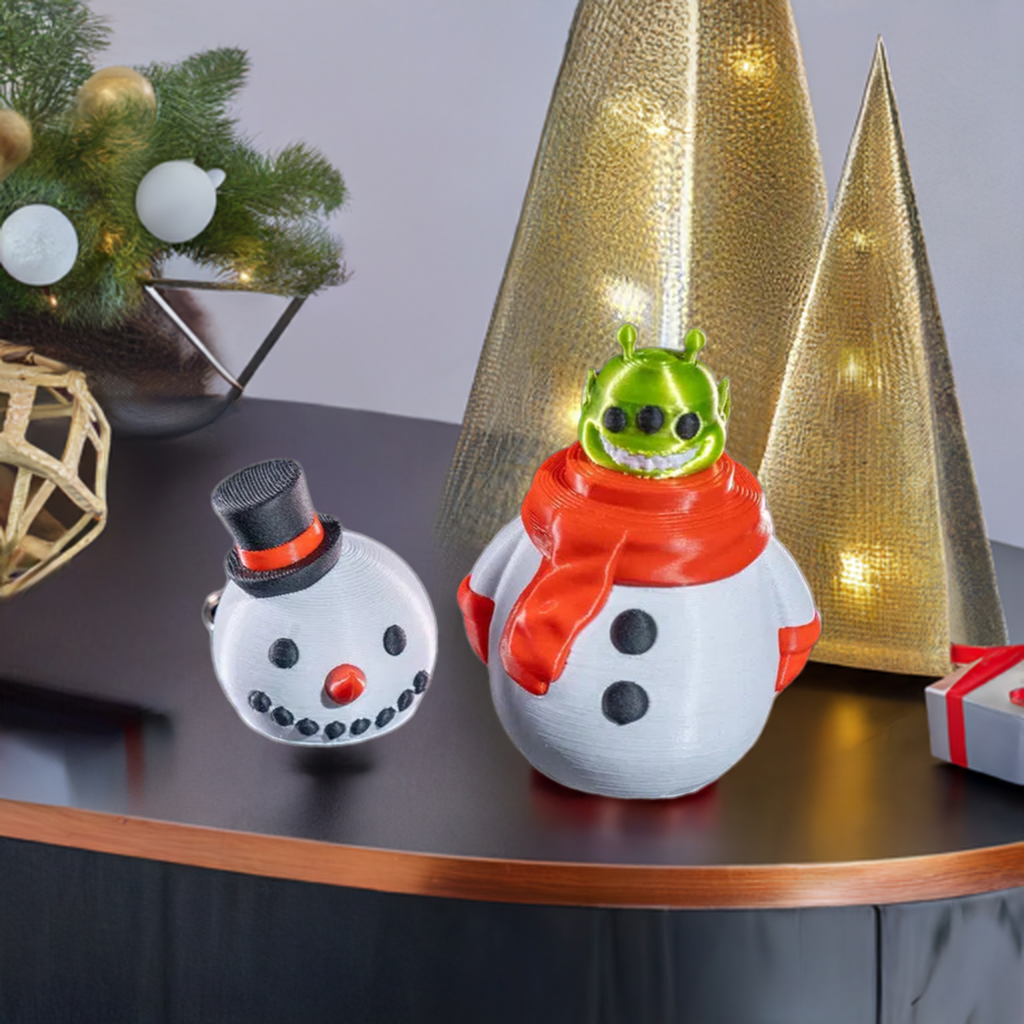 A whimsical decoration featuring a snowman with a removable head revealing a green alien, set against a festive holiday decor background.