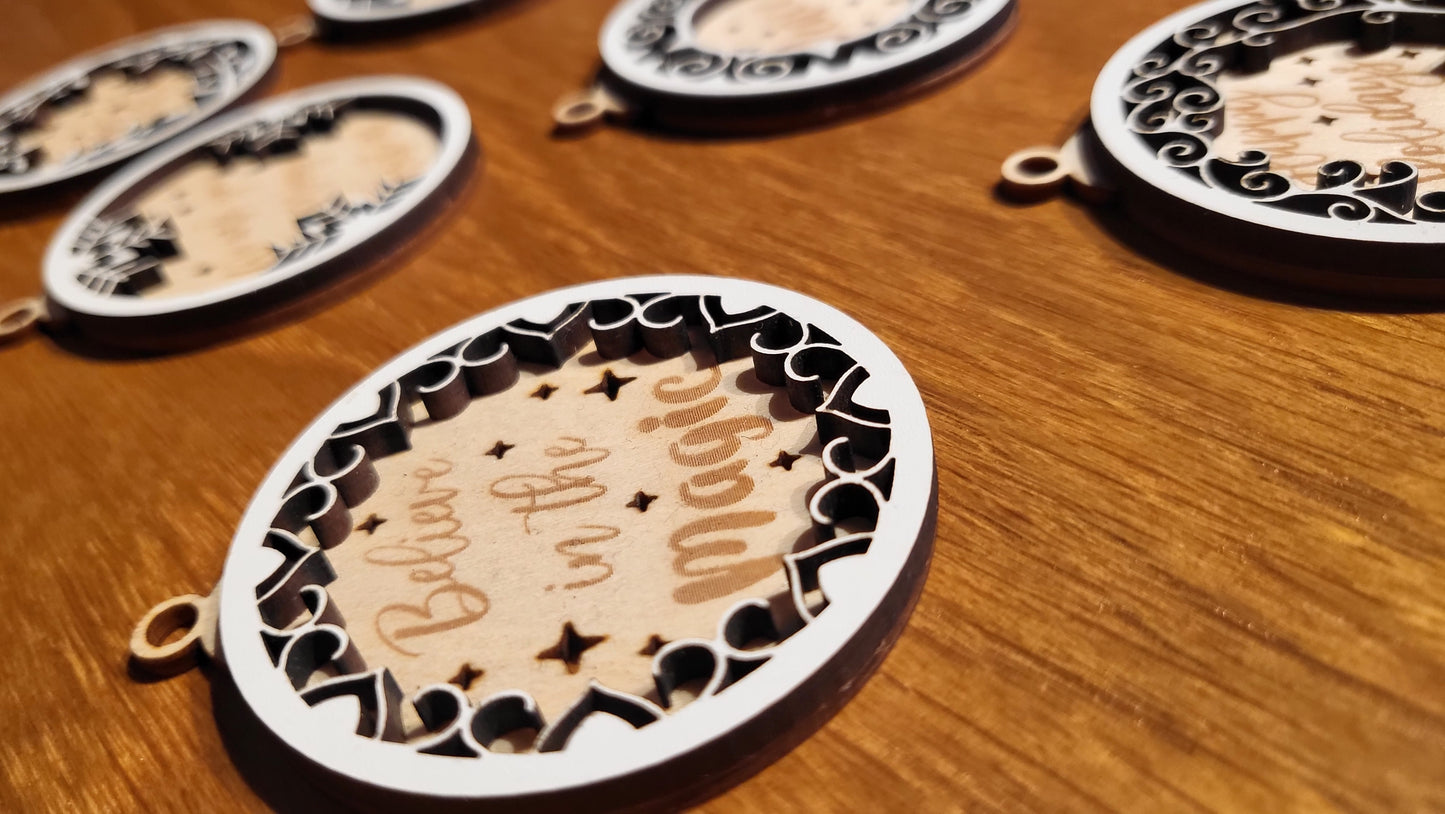 Close-up of a wooden ornament engraved with "Joy to the World" with a festive border.