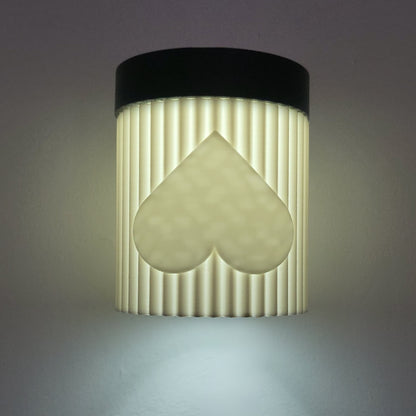 Wall-mounted light fixture with a unique design on a gray background