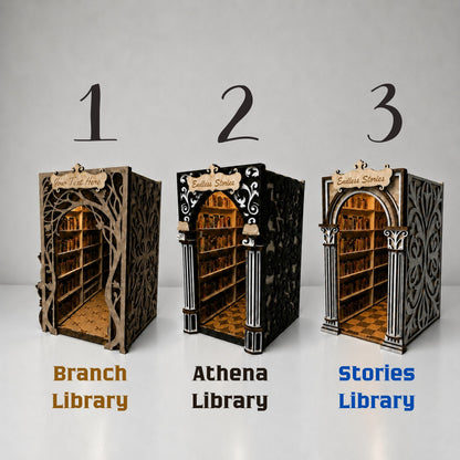 Three miniature decorative library models shown side by side with labels: Branch Library, Athena Library, and Stories Library. The designs feature different ornate wood and black-and-gold architectural details, with numbered 1, 2, and 3 above each model on a light gray background.
