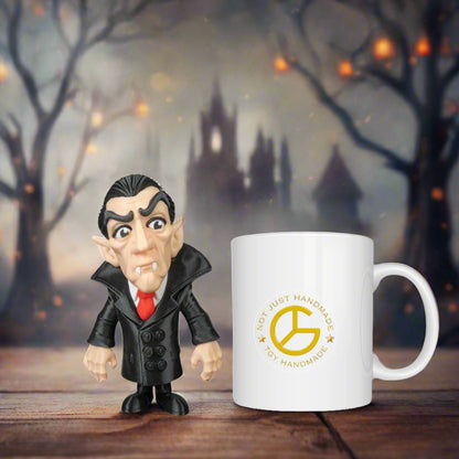 Vampire figurine next to a mug with a logo on a wooden surface with a Halloween-themed background