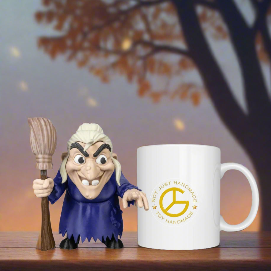 Animated character with a broom next to a mug with a logo on a wooden surface.