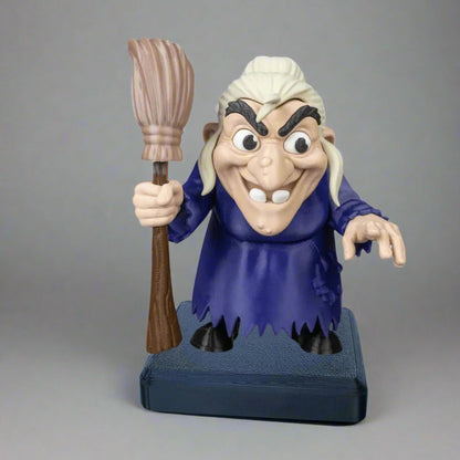 Toy figure of a character with a broom against a gray background