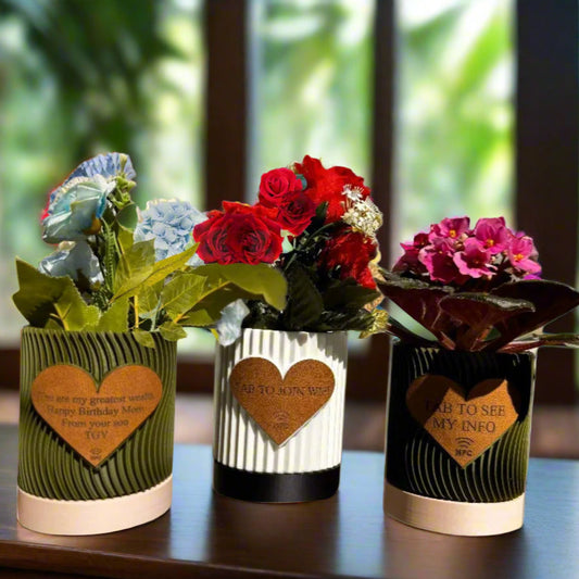 ultiple engraved pots displayed on a shelf with varied messages
An arrangement of several personalized flowerpots on a wooden shelf, each engraved with different heartfelt messages such as “Thank You,” “Grow Together,” and “Love Blooms Here.” The variety showcases the customization options and makes the display visually appealing, ideal for group gifting or themed home decor.