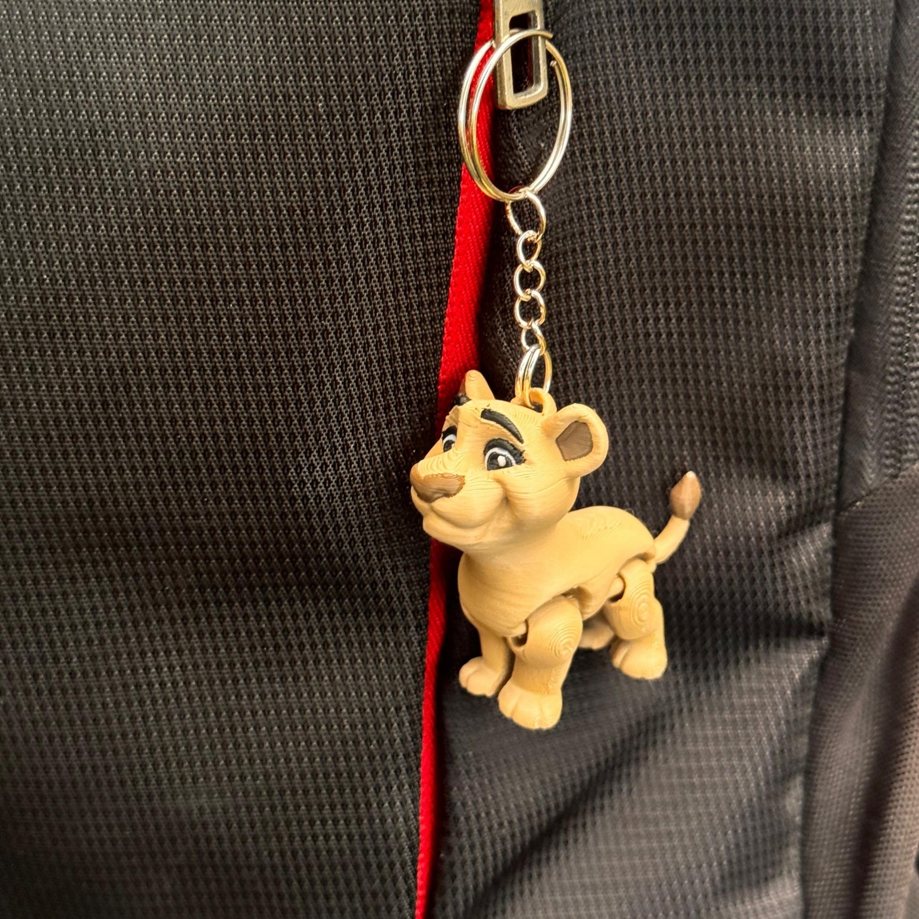 Multiple lion couple keychains in different colors are lined up in a row, offering variety for shoppers. Each one has its own slightly unique texture and finish, proving how one-of-a-kind and collectible these little companions can be.