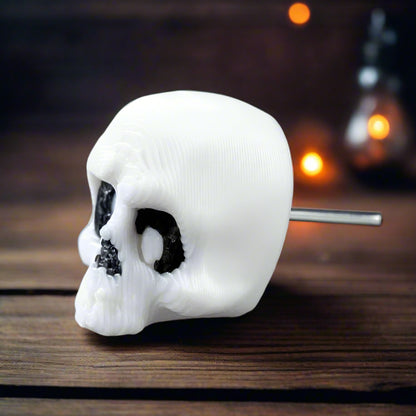 Child wearing one skeleton earring and smiling, demonstrating the playful, kid-friendly side of this lightweight Halloween-themed jewelry piece.