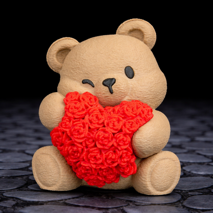 Teddy bear holding a red heart-shaped object on a dark textured surface