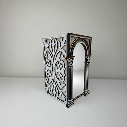 Decorative metal screen with intricate cut-out patterns on a plain background