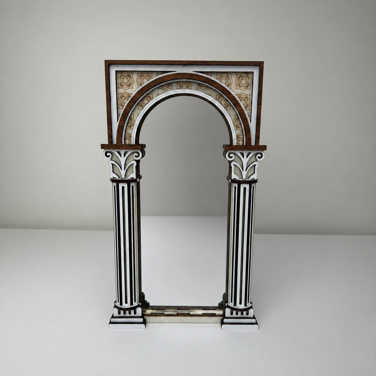 Decorative arch with columns on a plain background