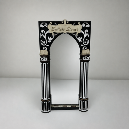 Decorative arch with 'Endless Stories' text on a white background