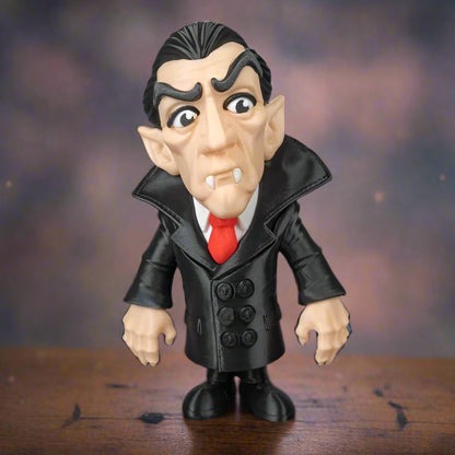 Toy figure of a character in a black coat with a red tie on a wooden surface