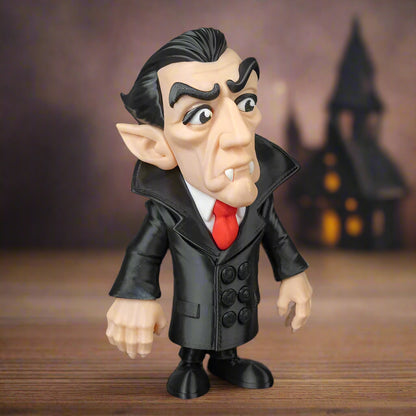 Toy figure of a character with a black coat and red tie on a black background