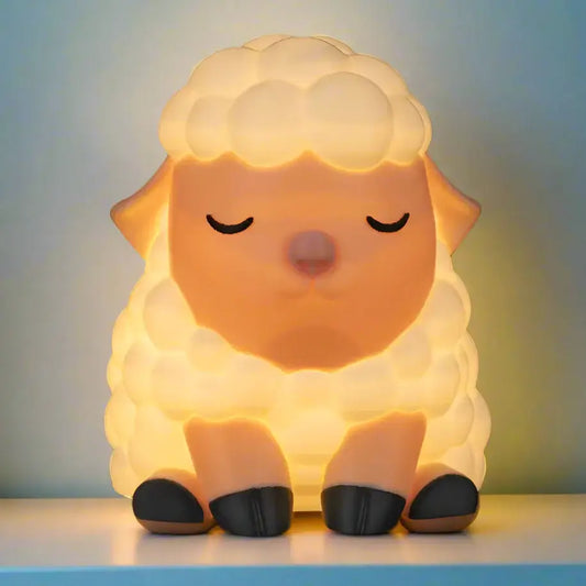 Sheep-shaped night light on a plain background
