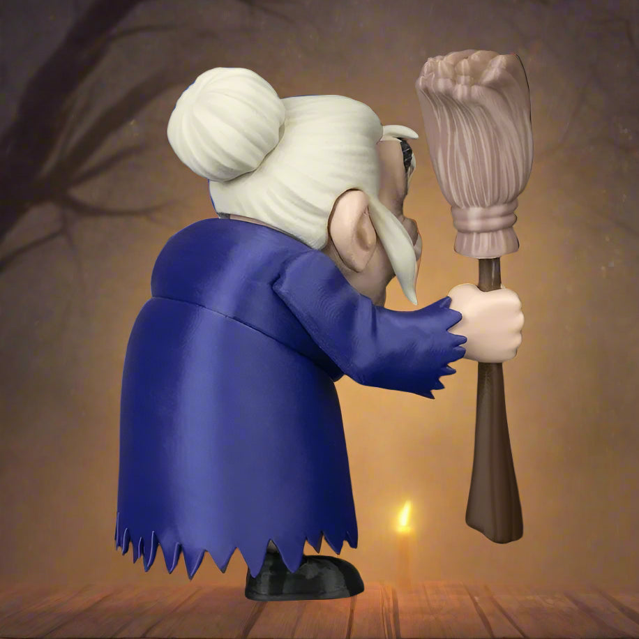 Figurine of an elderly character with white hair and a blue robe holding a broom against a black background