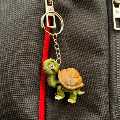 Group shot of the Riverbank Gang keychains on a neutral background, with their cheerful faces and jungle river feel.