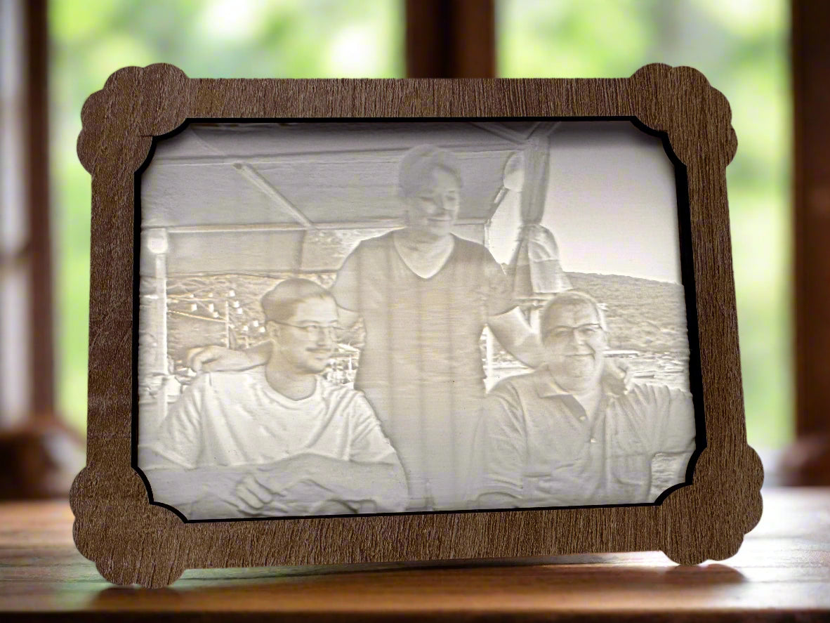 Wooden picture frame with a vintage-style photo of three people inside