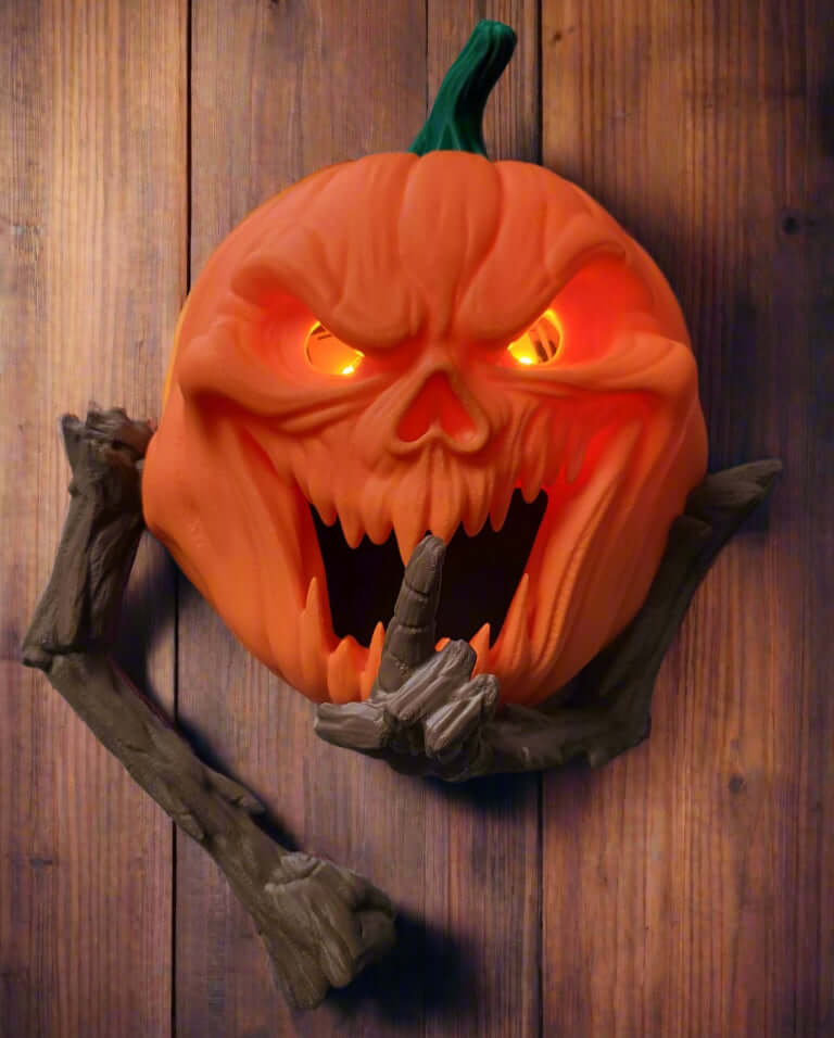 Halloween pumpkin decoration with face and arms on a wooden background