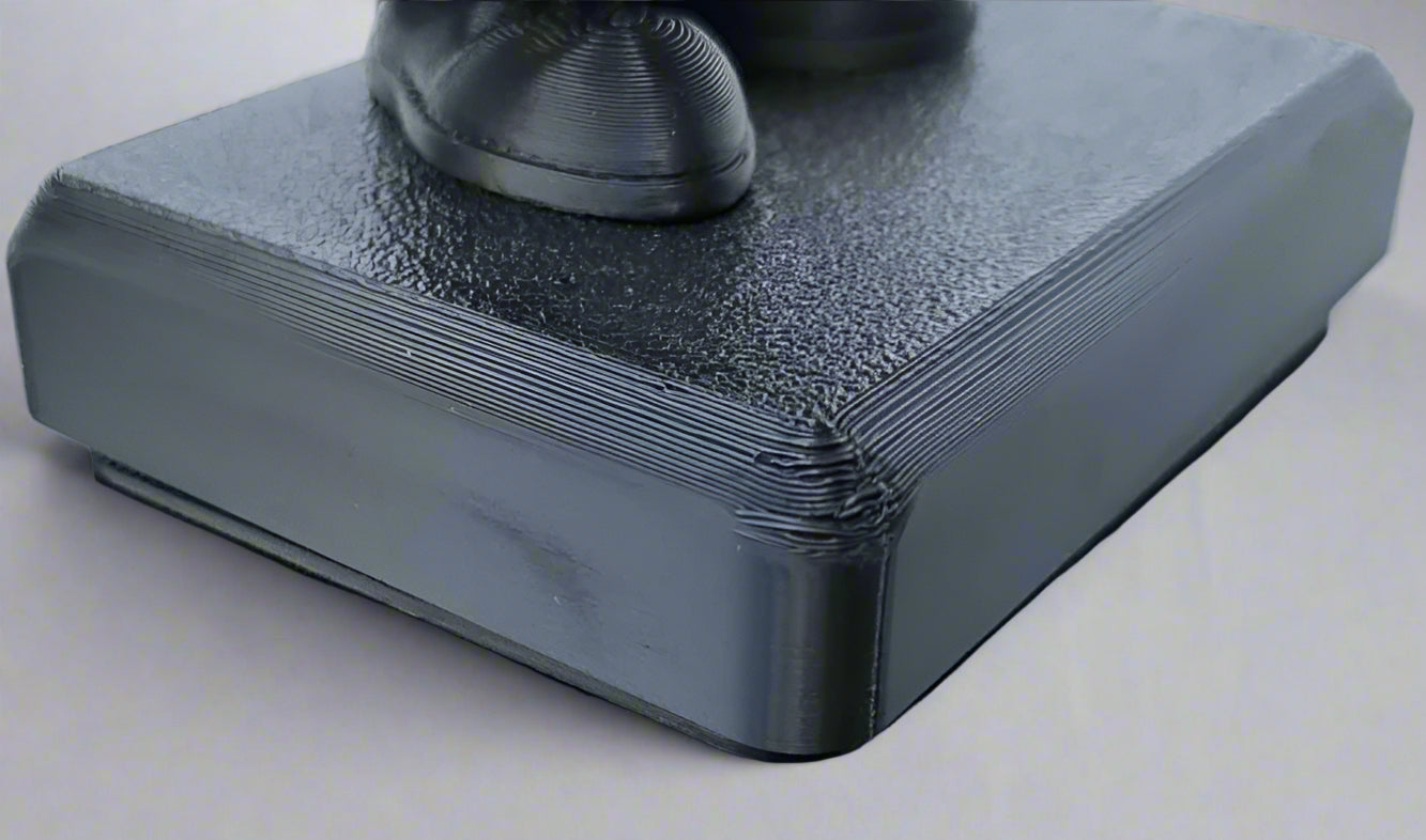 Stack of gray napkins with a black shoe on top