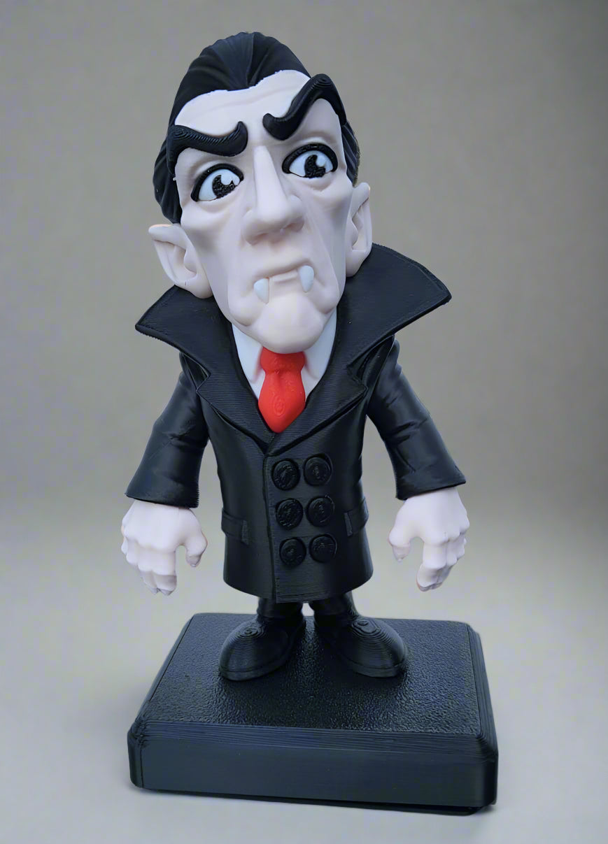 Animated character figurine with a black coat, red tie, and white gloves on a gray background