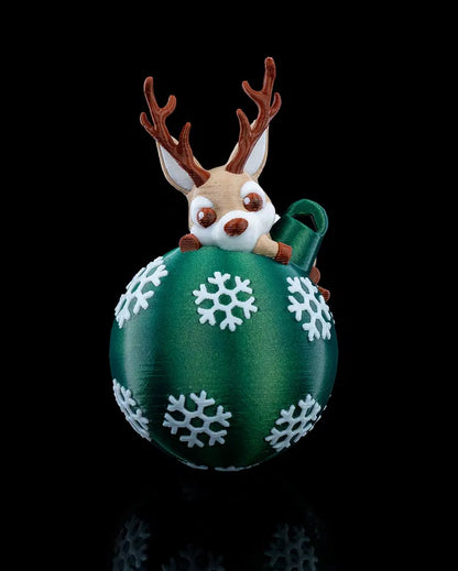 Lying Reindeer Christmas Tree Decoration - Front view with reindeer resting on ornament globe