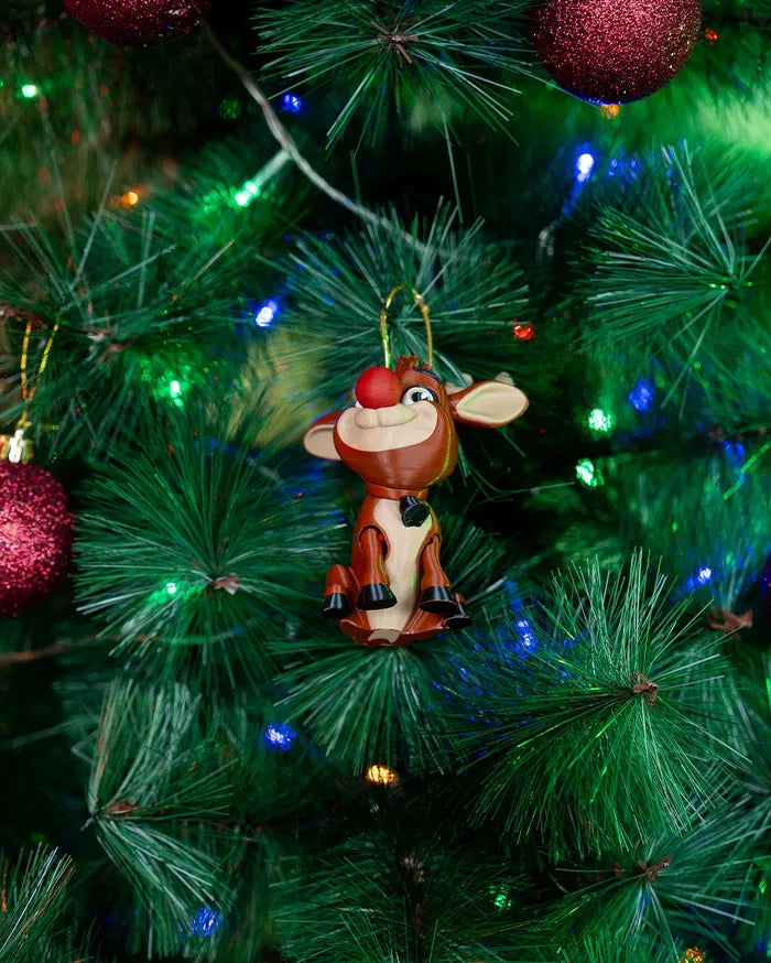 Rudy the Red-Nose hanging as a festive Christmas tree ornament.