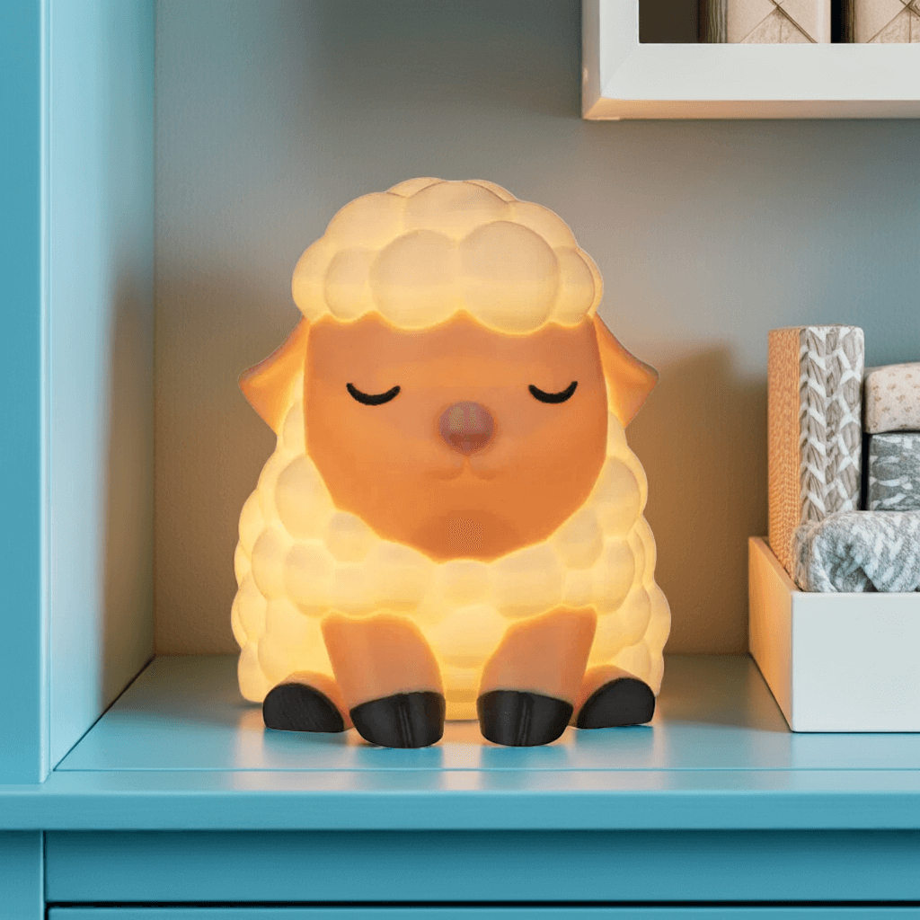 Sheep-shaped night light on a shelf with a blue background