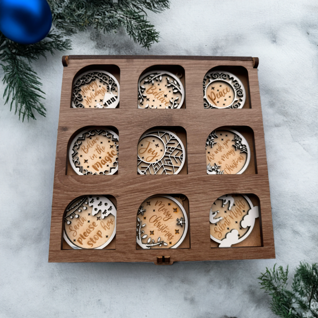 Set of 9 wooden Christmas ornaments neatly arranged in a wooden box.