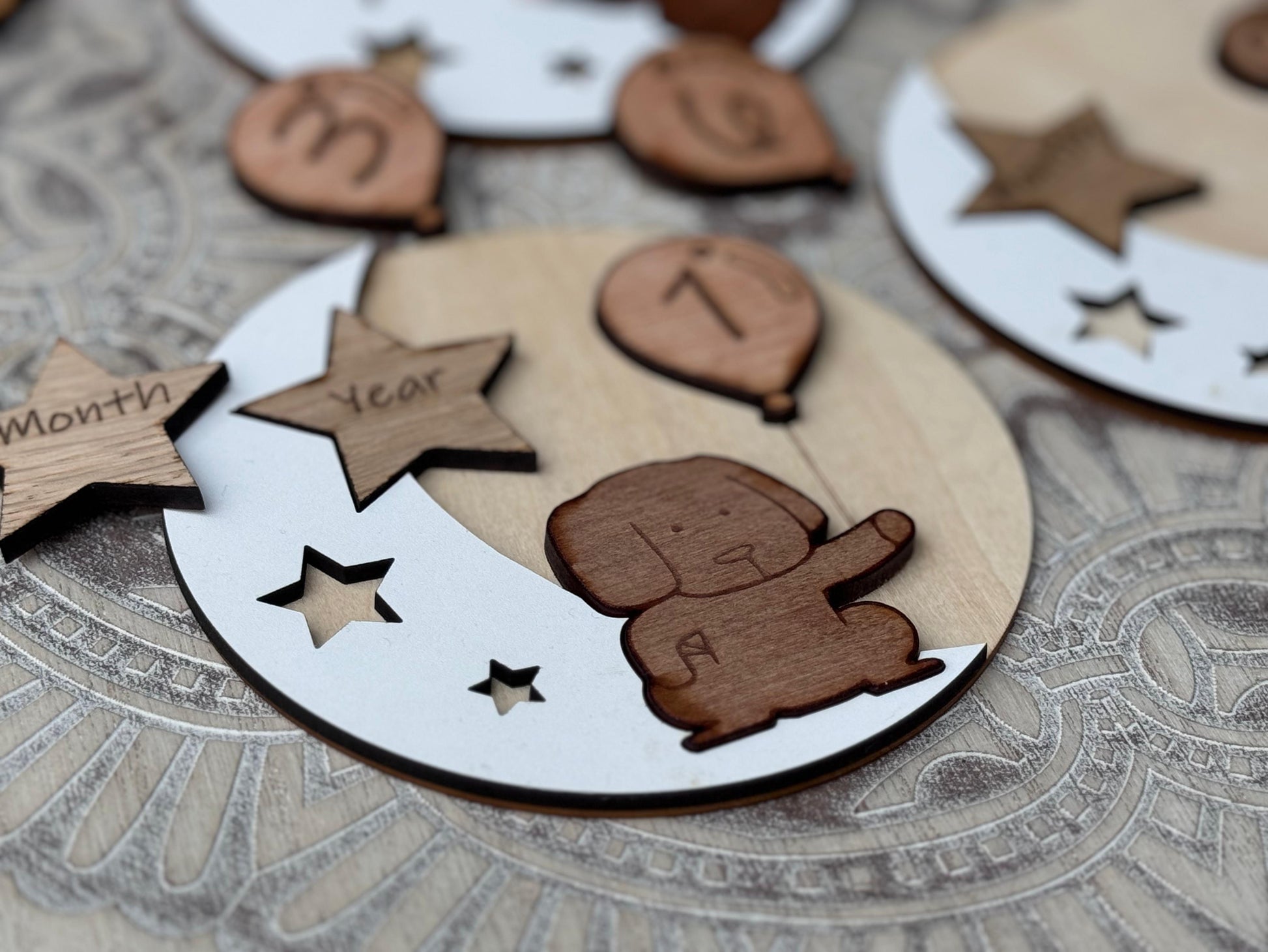 Wooden Baby Milestone Set – adorable wooden snowman, elephant, and dog designs for baby photos.