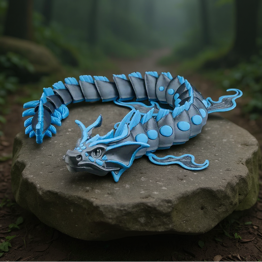 Blue dragon figurine on a rock with a forest background