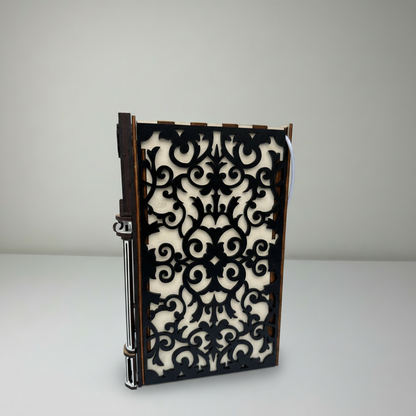Notebook with decorative black and white pattern on a gray background